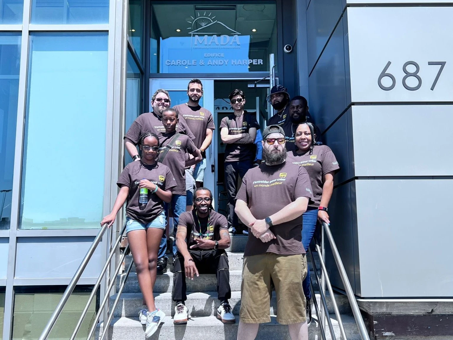 A shared commitment to community. Together at MADA during a UPS volunteering initiative in 2023.